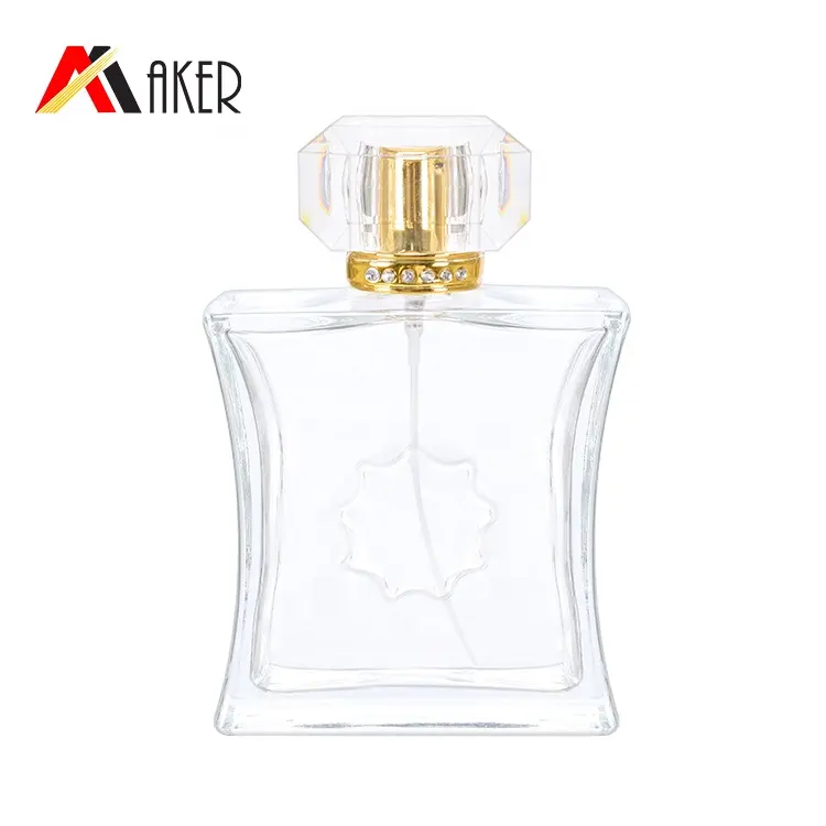 Botella de vidrio de perfume de cristal transparente de forma cuadrada especial vacía de lujo de 100ml con tapa acrílica de pulverizador de aluminio dorado