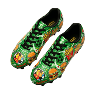 Chaussures de football personnalisées en gros pour hommes, imprimées de dessins animés (burger, frites), crampons pour terrain ferme, respirantes, pour entraînement extérieur en hiver