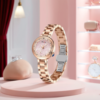 Montre à quartz en or rose pour femme avec cadran rose super lumineux Diamètre du cadran 30mm Affichage du pointeur en strass Produit OEM