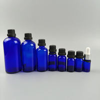 Fournisseur en gros de flacons d'huile essentielle en verre bleu de 5 ml, 10 ml, 15 ml, 20 ml, 30 ml, 50 ml, 100 ml avec bouchon en PP et compte-gouttes, conteneur cosmétique