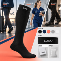 Chaussettes de compression noires avec logo, support du mollet à compression graduée, bordure large, pointe plate, avec tableau de mesure, vérifiées pour le travail