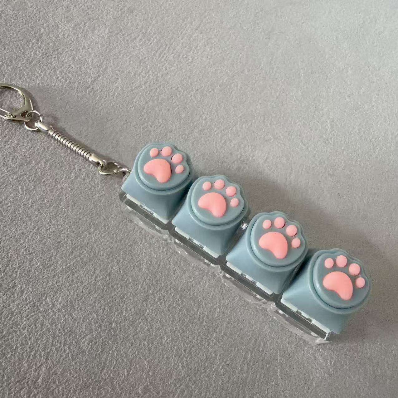 Coque transparente à quatre boutons - patte de chat grise en silicone