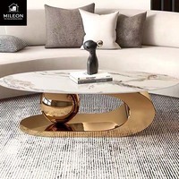 Table basse ovale de luxe en marbre de style européen et américain, avec support créatif en métal en forme de boule, pour salon moderne