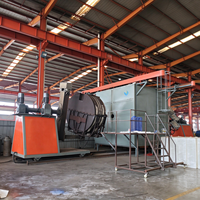 Machine de rotomoulage de type navette pour la fabrication de barrières routières