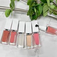 Nouveau style Huile à lèvres repulpante aux fruits Marque privée, Baume à lèvres liquide hydratant végétalien, Gloss à lèvres végétalien à l'acide hyaluronique Marque privée
