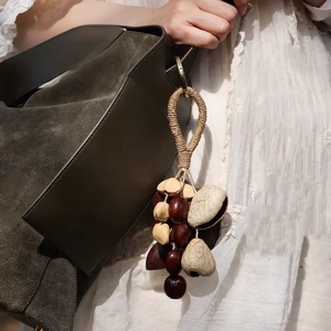 Wholesale Handcrafted Natural Fruit Shell Bag Charm Boho Seed Pod Mini <b>Wind</b> <b>Chime</b> For Gift And Bag Decoration - Product Image 3