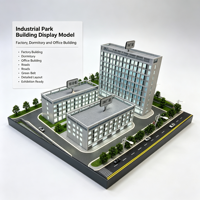 Maquette de parc industriel avec bâtiments d'usine, dortoirs, immeubles de bureaux, routes et ceinture verte