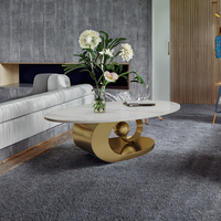 Table basse moderne en acier inoxydable sculptural avec plateau en marbre pour salon