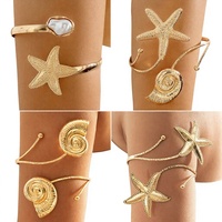 Bracelet de bras bohème en métal avec papillon et feuille pour femme, ajustable, avec pendentif à sequins et breloque à pompon, manchette de bras, bijou de corps