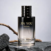 Vente en gros d'usine, flacon de parfum en verre vintage à logo personnalisé, dégradé de couleurs, cylindrique, fond épais noir, vaporisateur à pompe, écologique