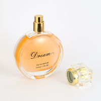 Parfum pour femme en verre, liquide orange cristallin, capuchon à facettes, vaporisateur doré, motif, boîte marron, rêveur, longue tenue