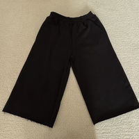 Pantalon Baggy Noir Femme Taille Élastique 7/8 Coupe Large Cropped avec Ourlet Brut et Poches – Vêtements de Créateur