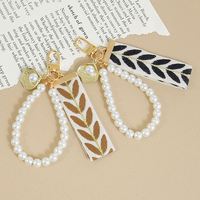Porte-clés lumineux, cordon pour téléphone, design feuille, pendentif en perle, écouteurs, décoration de fête d'anniversaire, cadeau