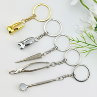 Porte-clés créatif en alliage de zinc, motif dessin animé, pince dentaire, pendentif personnalisé, breloque de sac gadget