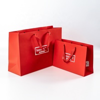 Élégant sac en papier à provisions en ruban robuste personnalisable sac à vêtements moderne à poignée plate pour chaussures sac cadeau enduit