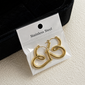 Pendientes de acero inoxidable con geometría irregular y estilo minimalista - Product Image 5