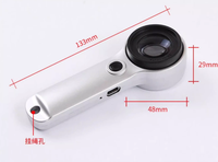 60X Rechargeable LED Handheld Magnifier for Jewellery Appraisal, Coin and Stamp Inspection.