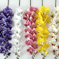Vente en gros de tiges d'orchidées artificielles en plastique à 9 têtes, effet réaliste, fleurs artificielles pour les décorations florales de mariage, d'hôtel et de table