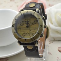 Womage-568-1 Montre rétro Womage avec boîtier en alliage, mouvement à quartz, bracelet en cuir, style punk, motif note de musique, vente en gros disponible