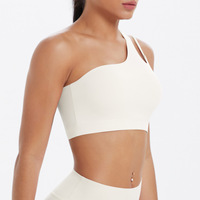 Sujetador deportivo asimétrico de un solo hombro para mujer al por mayor, con espalda recortada, transpirable, de Spandex/Nylon, soporte medio, a prueba de golpes, para correr y gimnasio.