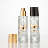 Boîte cadeau cylindrique personnalisable avec couvercle noir, flacon de parfum en verre transparent vide avec pompe pulvérisateur et design perforé, 30ml 50ml 100ml