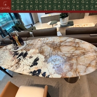 Table à manger ovale de luxe GOLDKING avec plateau en marbre Patagonia, base en métal brossé, OEM ODM CAD 3D personnalisé pour maison moderne