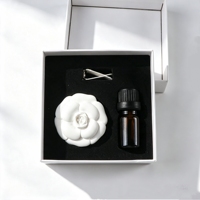 Diffuseur d'huiles essentielles en porcelaine parfumée en forme de fleur de camélia en céramique pour voiture et maison, désodorisant en plâtre pour grille d'aération, vente en gros