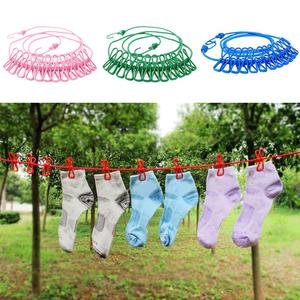 Corde à linge rétractable portable en fer à fixer au mur, coupe-vent, avec 12 pinces, pour voyage, vente en gros - Product Image 1