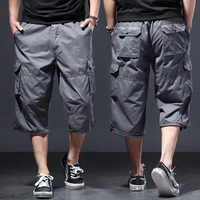 Shorts mi-longs pour hommes, motif uni, fermeture éclair, coupe ample, multi-poches, shorts décontractés, shorts de plage, shorts cargo pour hommes, shorts de sport