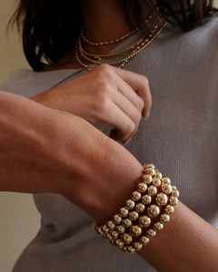 Bracelet empilable de haute qualité, imperméable, pour l'hiver, en acier inoxydable plaqué or, avec perles rondes de plusieurs tailles, style déesse. - Product Image 2
