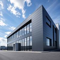 Edificio de Oficinas Prefabricado de Acero Contemporáneo con Ventanas de Vidrio de Altura Completa y Revestimiento Metálico Gris Oscuro