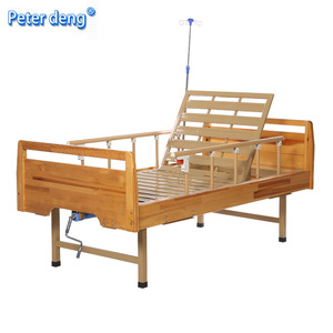 Cama de Hospital Manual Peter Deng de Madera con Manivela Simple y Barandilla para Pacientes Mayores o Paralizados - Product Image 1