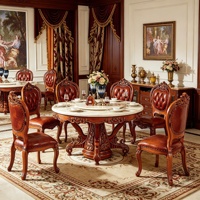 Ensemble de salle à manger rond en bois massif sculpté à la main de style européen de luxe avec plateau en marbre naturel et chaises en cuir PU pour villa, hôtel, vente en gros
