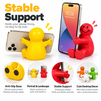 Support de téléphone portable de bureau 2-en-1 Happy Dude à bras ouverts en mousse PU anti-stress pour l'éducation