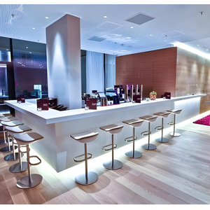 White minimalist L-shaped bar counter installed in teacher lounge