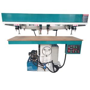 Machine de perçage hydraulique verticale multi-têtes pour le travail du bois, idéale pour le prétraitement des matériaux de construction de meubles et de portes - Product Image 1