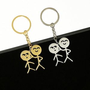 Divertido y parodista colgante para bolso de personaje de dibujos animados, llavero de acero inoxidable al por mayor con diseño de pareja de caras que se pellizcan y mecha de cerillas - Product Image 1