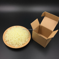 Colle thermofusible polyoléfine en particules blanches pour scellage rapide de films et de boîtes, transport, construction et emballage