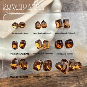 Strass pour nail art K9 de haute qualité Paso Sico Melanoiding ; Nouveaux strass tendance jaune fumé en forme d'œuf et de cœur incliné pour ongles - Product Image 1
