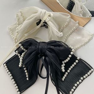 Pinza para el cabello con lazo de perlas súper mágico para la parte posterior de la cabeza de las mujeres, estilo Mori girl, peinado medio recogido, accesorio para el cabello - Product Image 1