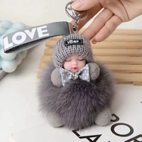 Porte-clés poupée bébé endormi avec nœud, pompons mignons, grands yeux, pendentifs pompons roses duveteux