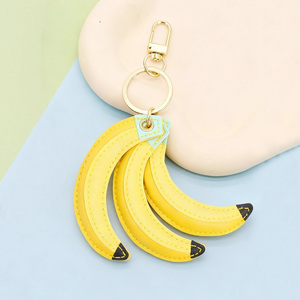 سلاسل مفاتيح فاخرة قابلة للتخصيص على شكل فاكهة الموز من الجلد الصناعي للنساء، إكسسوارات وحليات بالجملة - Product Image 1