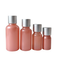 5ml 10ml 15ml 20ml 30ml Bouteille d'huile essentielle en verre rose brillant avec couvercle en argent Bouteilles d'huile de massage personnalisées Récipient en verre