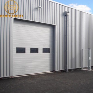 <span class=keywords><strong>Porte</strong></span> sectionnelle industrielle motorisée à levage isolé pour plafond bas, gain <span class=keywords><strong>de</strong></span> place, pour bâtiment commercial - Product Image 1