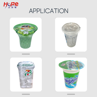 Remplissage de liquide de remplissage de granulés à double tête rotative et machine de thermoscellage de film en rouleau pour tasse en plastique PET PE PP