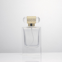 Flacon de parfum de luxe à fond épais de 50 ml avec vaporisateur, flacon de parfum rectangulaire en verre transparent de 100 ml avec couvercle doré
