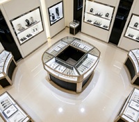 Vitrine d'exposition circulaire pour montres de luxe, en acier inoxydable et verre, pour la vente au détail