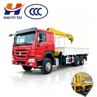 Camion grue Sinotruk Howo 6x4 d'occasion, en bon état, pour le transport de charges lourdes dans la construction