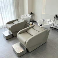 Lit de lavage des cheveux en cuir souple noir unique avec fonction de massage pour spa et salon de coiffure