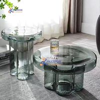 Table basse moderne minimaliste en métal avec plateau en verre pour le salon